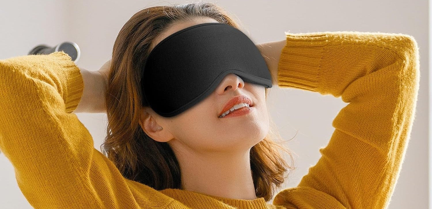 Woman relaxing wearing the keepsleep blackout sleep mask